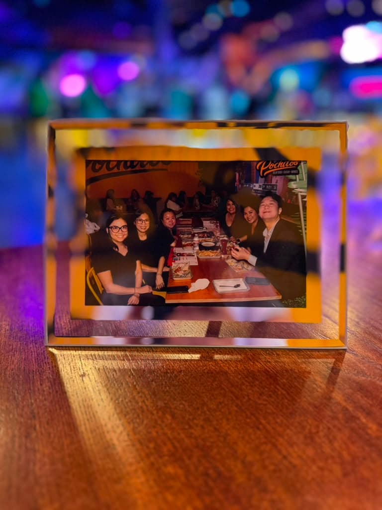 Gold frame delivered at restaurant table
